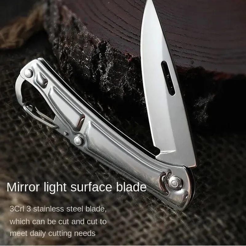 Pocket fruit cutter. Stainless steel. Non-slip grip. Folds for portability. Kitchen.