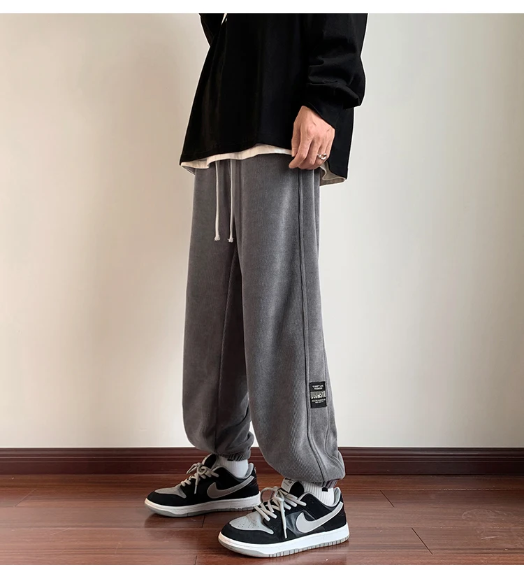 بنطلون رجالي جديد 2025 من قماش الكوردروي مبطن بالصوف فضفاض للعمل والرياضة في الخريف والشتاء مقاوم للتآكل ومضاد للأوساخ