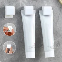 1-20PCS Toothpaste Holder Wall-mounted Face Wash Hanging Clip Self-Adhesive Toothpaste Clip Storage Rack Bathroom Accessories 1