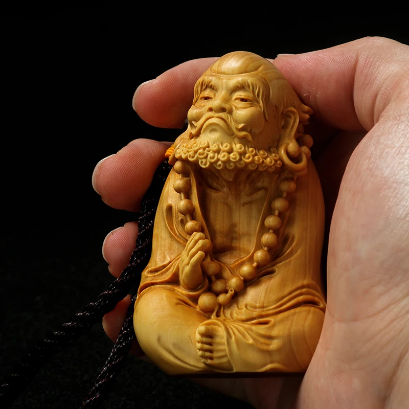 

Small leaf boxwood carving bodhidharma patriarch handgrip piece man with solid wood ornaments Chinese Buddha handicraft