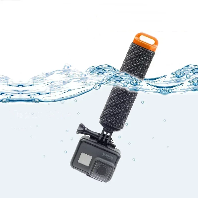 Poignée flottante jaune pour caméra action, vue de dessus avec dragonne, conçue pour activités nautiques.