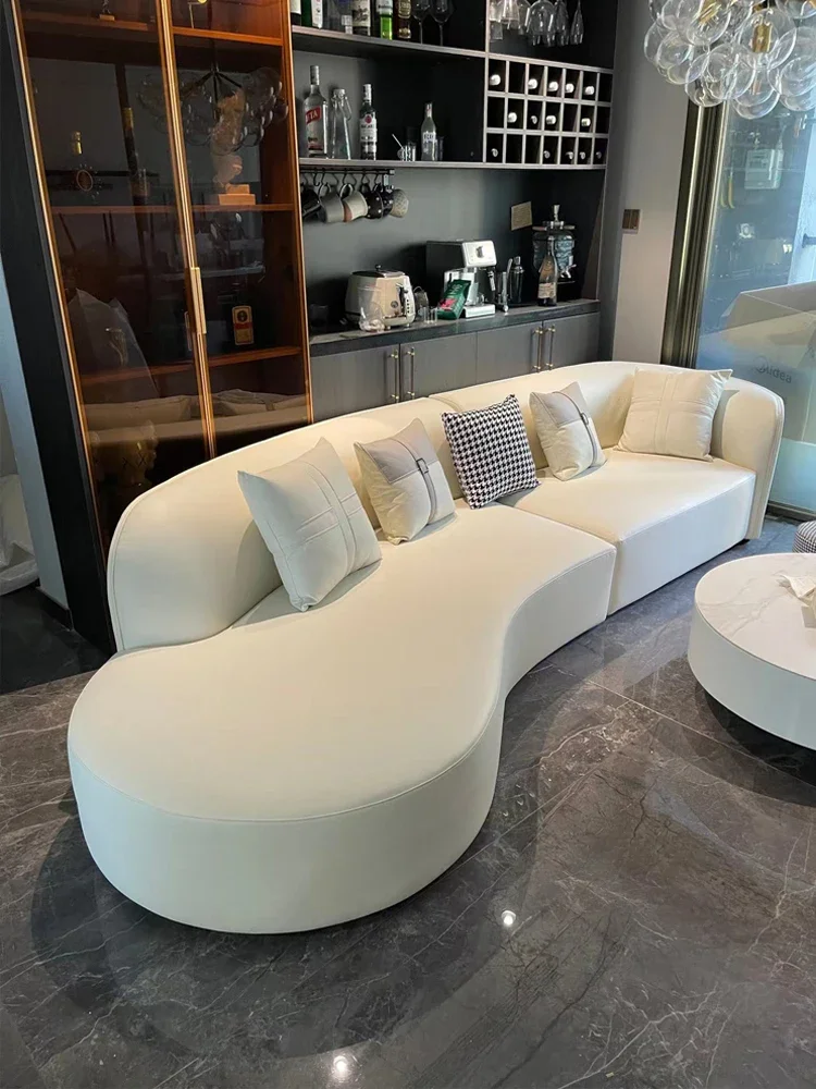 

Italian light luxury curved sofa with silicone leather and cream style, modern and simple living room for home use