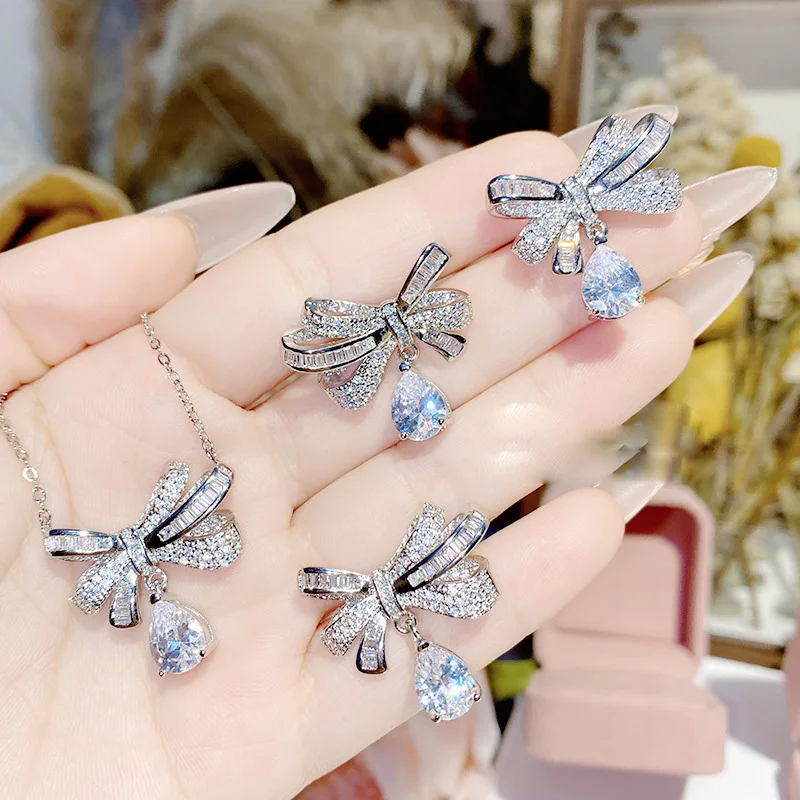 2023 Women Brilliant Bow Tie Earrings Plated 18K Gold Exquisite Water Drops Exaggerate Necklace Ring 5