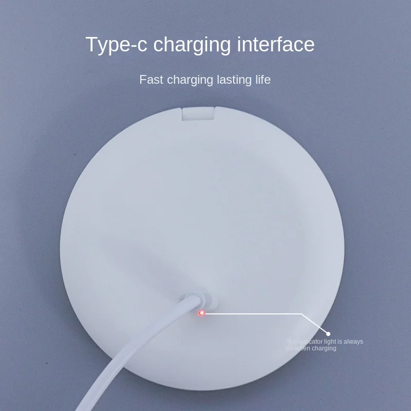Rechargeable pocket mirror with light showing touch switch and Micro USB charging port.