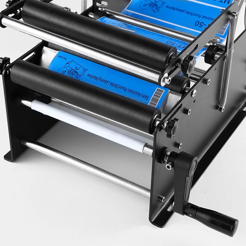 DN-MT-40 수동 원형 병 라벨링 기계, 투명 자체 접착 라벨링 기계, 작고 간단한