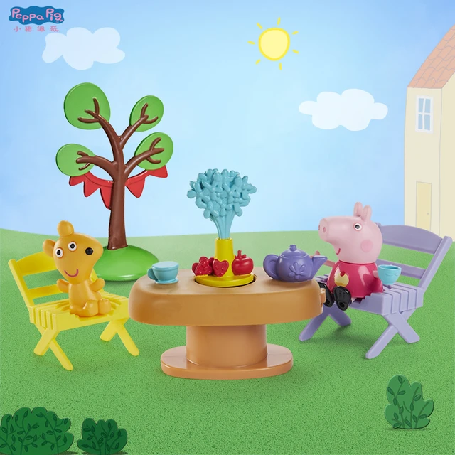 A plastic Peppa Pig toy play house standing on a table Stock Photo