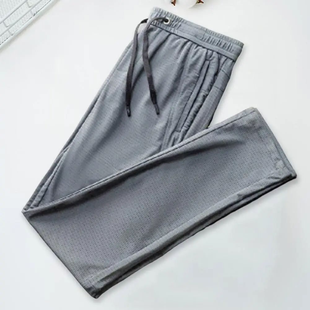 

Men Sport Pants Solid Color Breathable Deep Crotch Loose Drawstring Exercise Ankle-banded Zipper Pockets Mesh Men