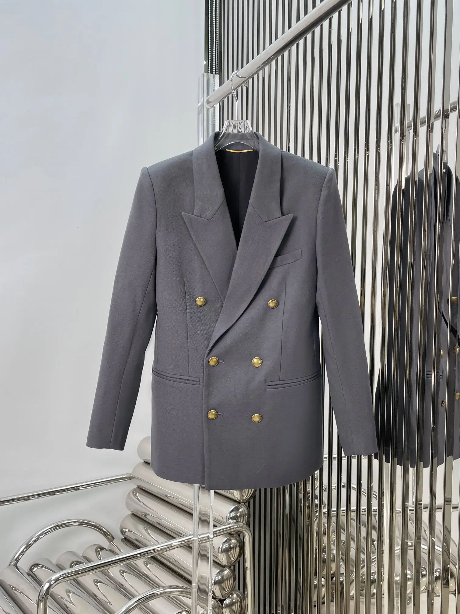 

Fashionable new gray suit with gold buttons