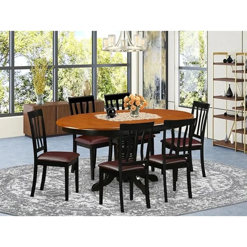 7-Piece Dining Set featuring an Oval Table with Butterfly Leaf and 6 Faux Leather Dining Chairs