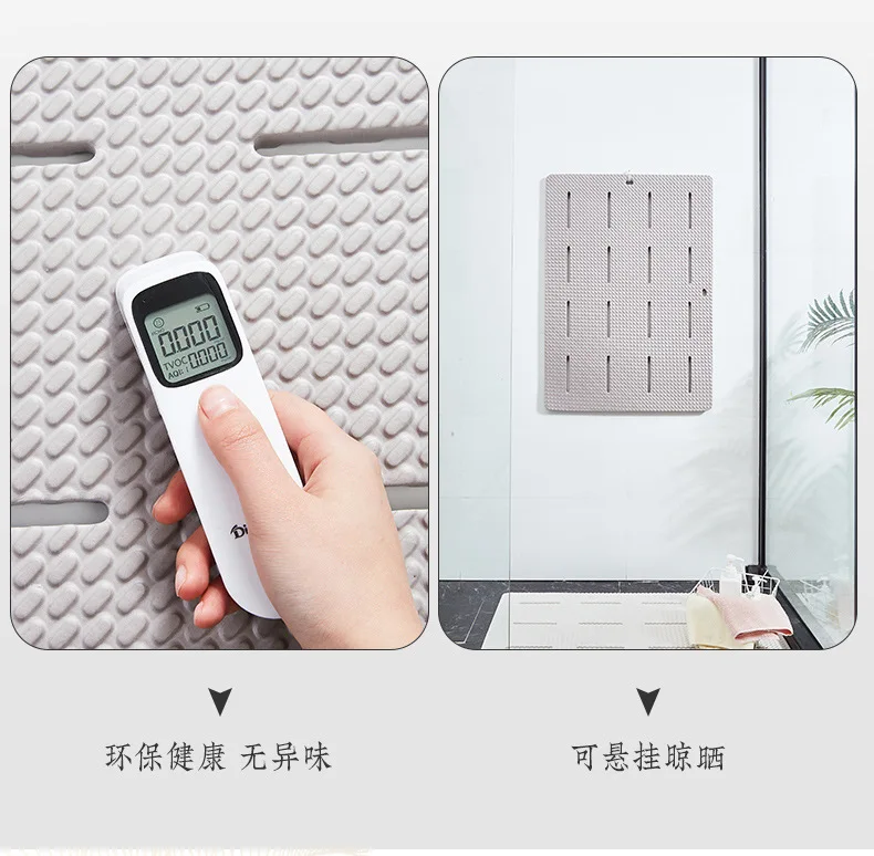 Non-slip bathroom mat with suction cups on a wet shower floor.