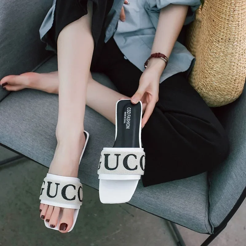 

Summer Women Slides Black White Designer Brand Fashion Woman Flat Heels Open Toes Slippers House Flip Flop Causal Sandals Hot