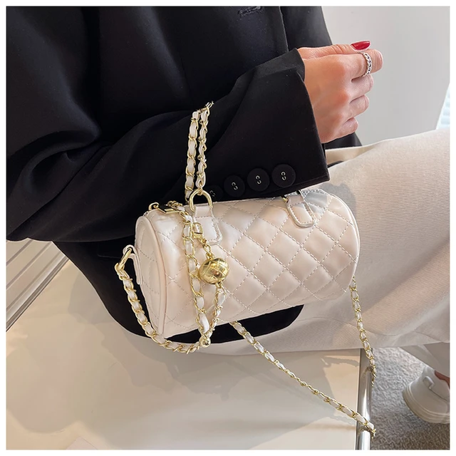 Woman with White Chanel Spere Bag before Genny Fashion Show, Milan