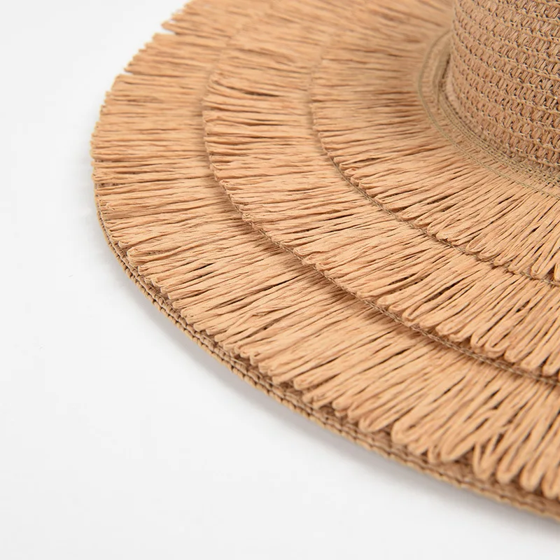 2023 Nowa moda damska Duże okapy Słońce Lato Projektant Plaża Ochrona UV Pusty Top Tassel Słomkowy kapelusz Hurtownie_voghion.com