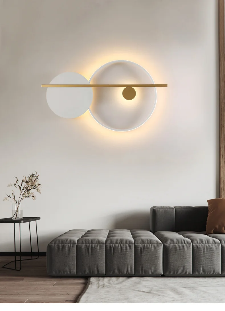 A minimalist living room with a circular wall sconce in matte white finish.