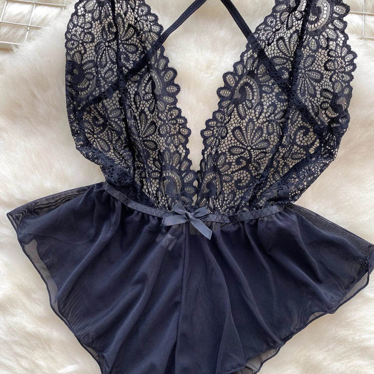 floral lace bodysuit with soft pink satin-style lower panel