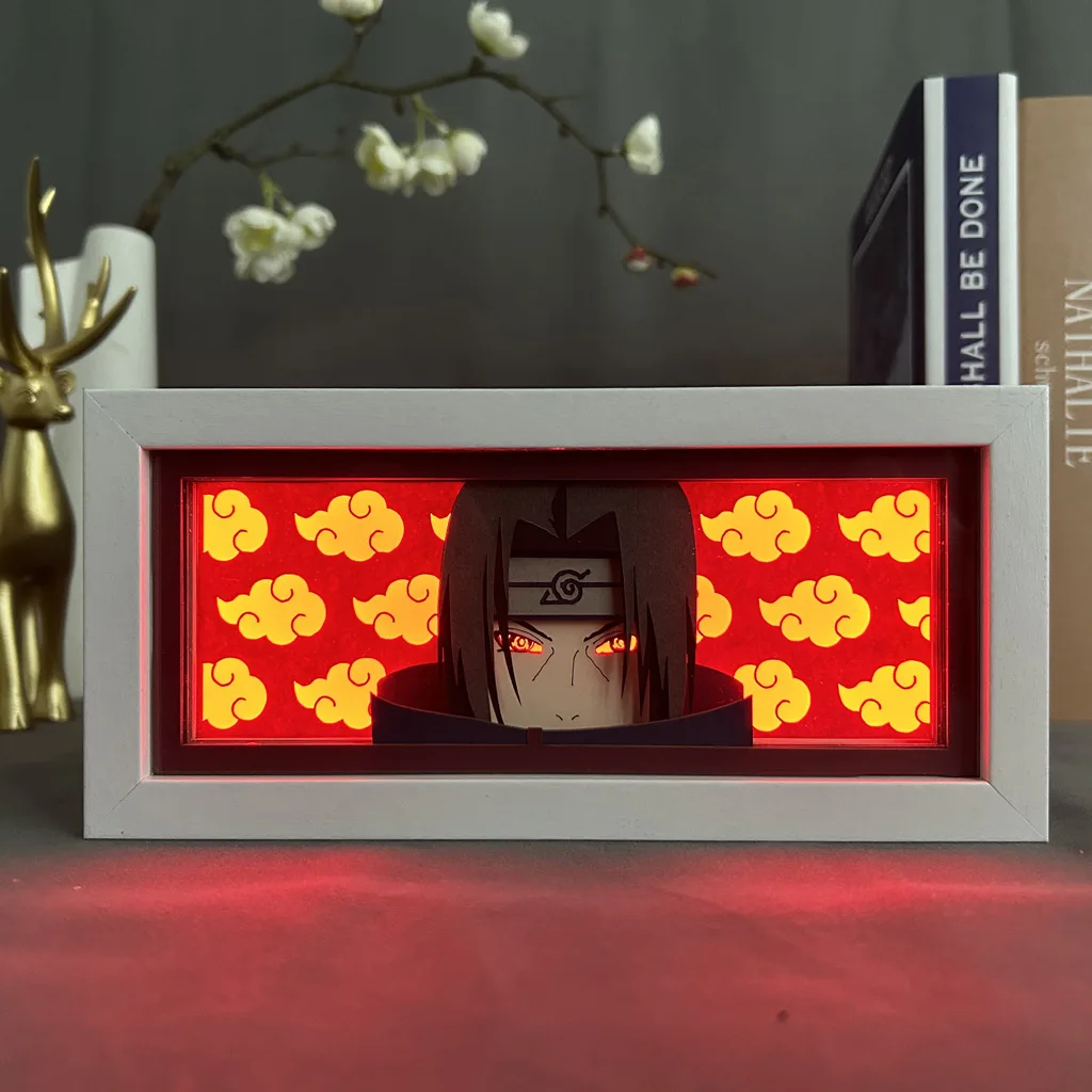 thumbnail image 1 of Periféricos de anime de NARUTO, figura de Itachi con luz LED, caja de sombras cortada con papel, figuras de Sasuke, caja de luz, estatua de Obito, adornos de escritorio, juguetes, 1 of 4