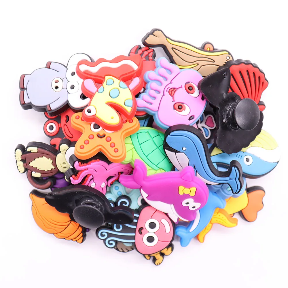 https://ae01.alicdn.com/kf/S06b8d90404e84e2e8642433ecffa7d49M/1Pcs-Octopus-Sea-Animals-Dolphin-Shark-Crab-Fish-Shell-PVC-Sandals-Shoe-Charms-Buckle-Clog-Croc.jpg