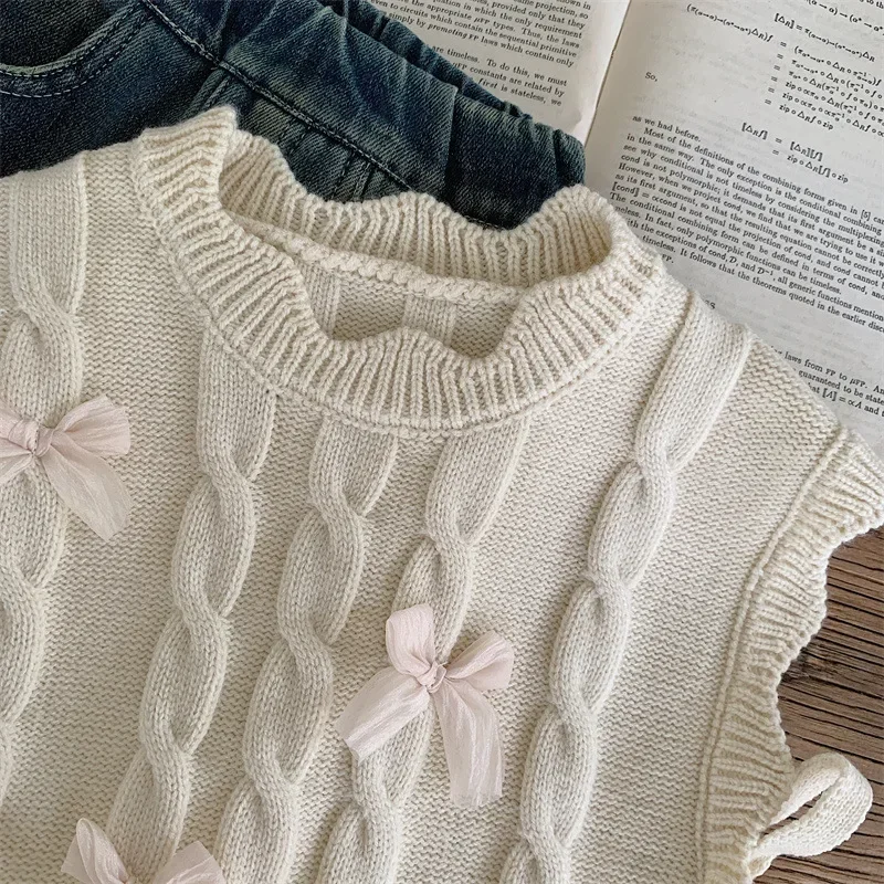 Girls knitted polka dot vest sweater in thick cotton material.