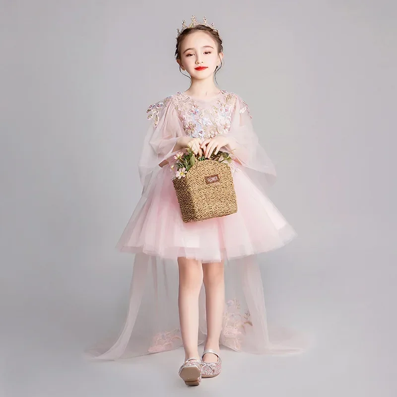 

Girl host trailing princess flower girl fluffy children's wedding runway show evening dress, piano performa