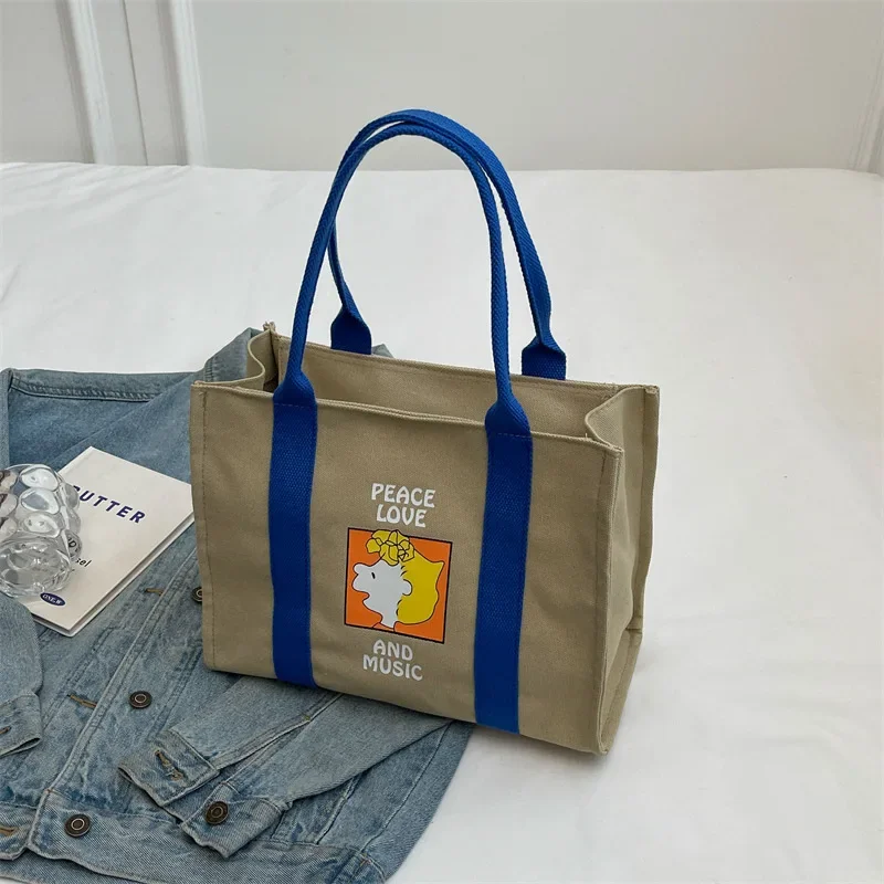thumbnail image 1 of Bolso de mano de Snoopy Charlie Brown, bolso de hombro de lona de gran capacidad, bolso de compras para estudiantes, bolso práctico de moda para mujeres, 1 of 5