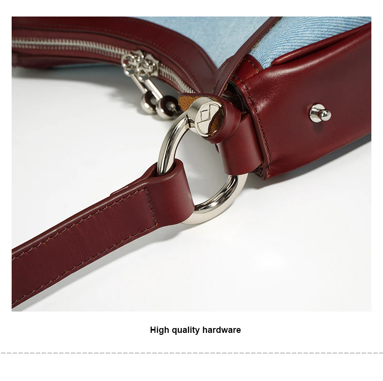 Half moon shoulder bag made of denim with genuine leather trim – casual and stylish design for daily use.