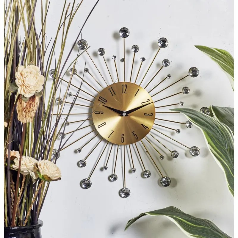 

Metal Glam Wall Clock, 15”L x 0.5”W x 15”H, Features Starburst Design