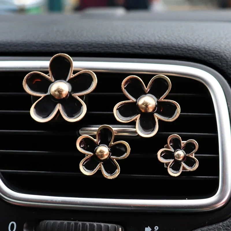 Floral Scented Car Vent Clip Air Fresheners in Pink, White, and Black