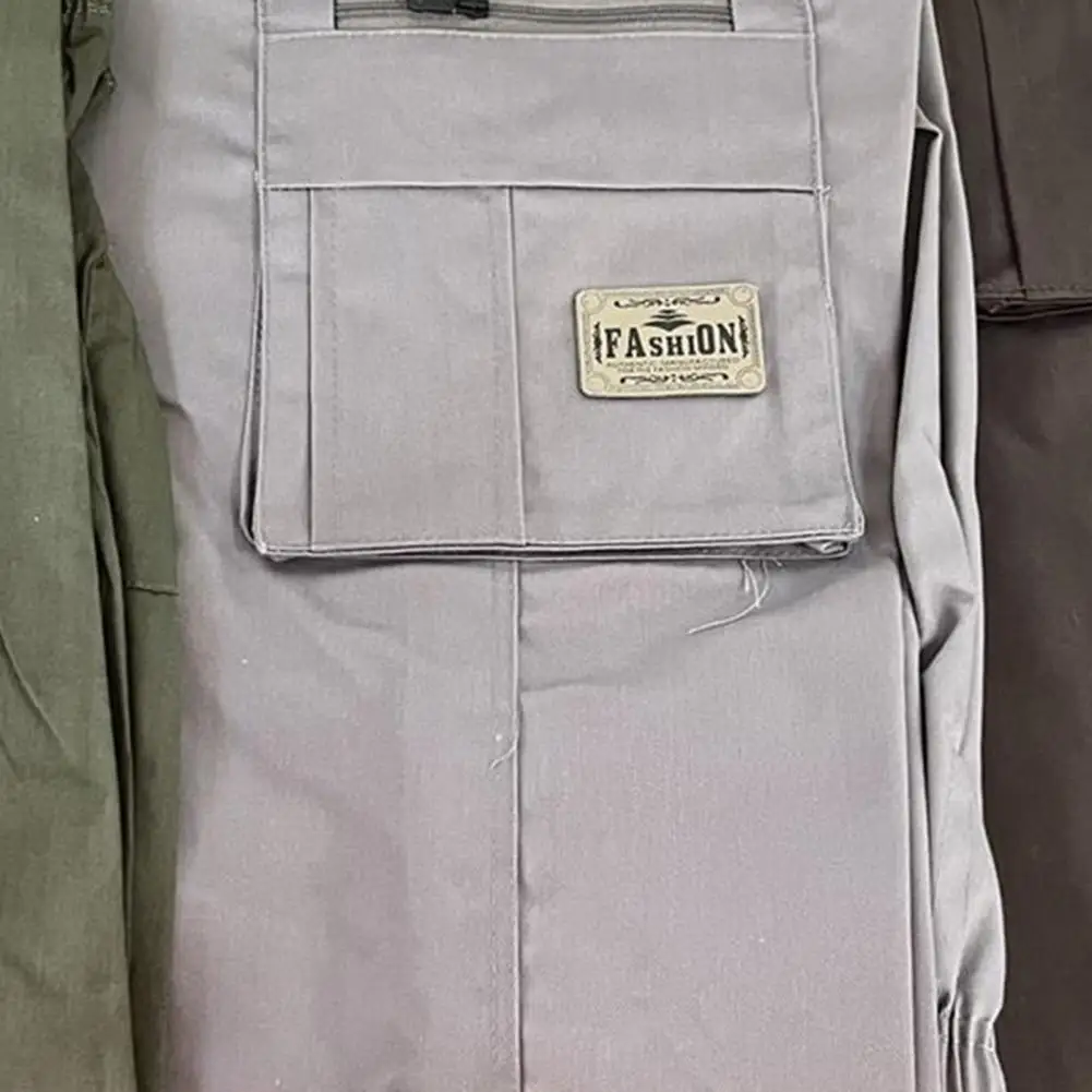 Description Picture 5 of itemSolid Color Pants Men's Wide Leg Casual Pants with Elastic Waist Multi Pockets Breathable Fabric for Comfortable Streetwear