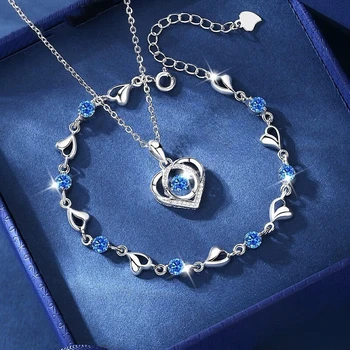 1723-27ec05.jpg Silver necklace and bracelet set with blue heart-shaped crystal