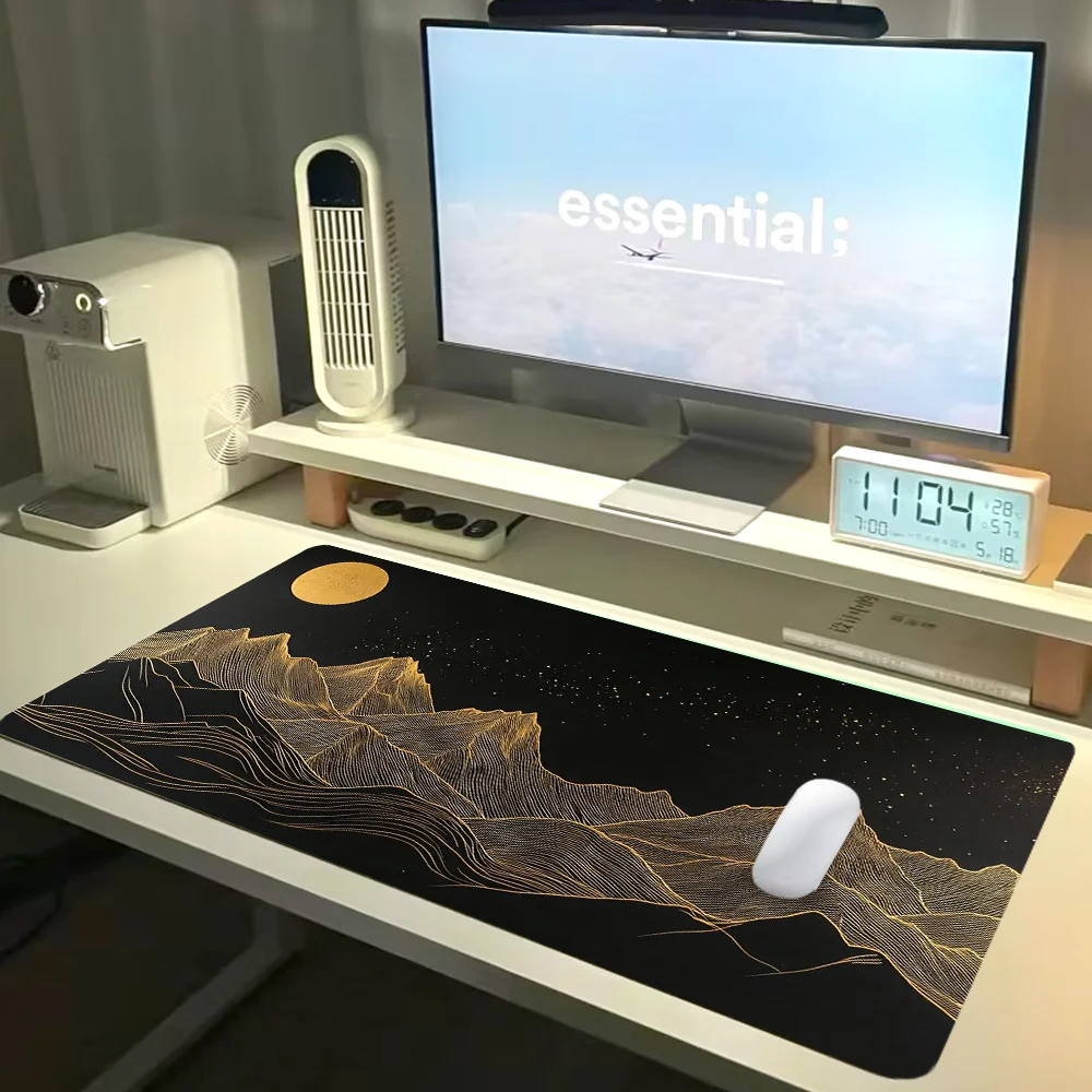 Large gaming mouse pad with artistic mountain design