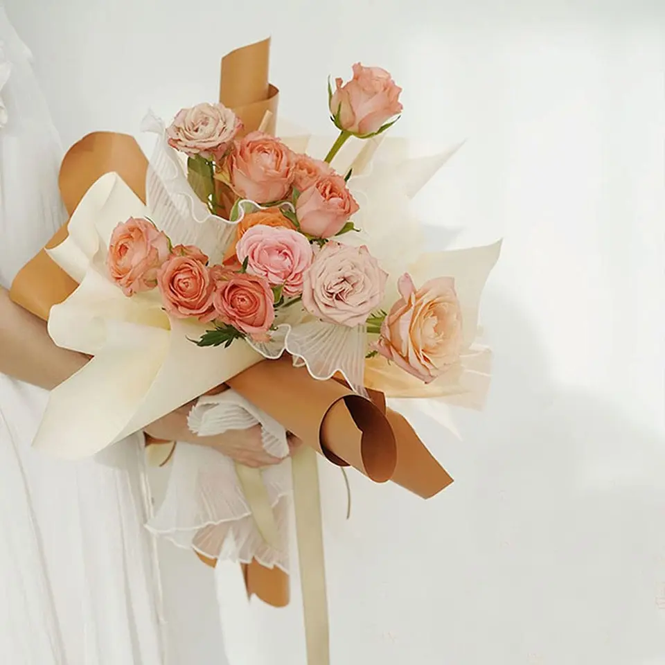 White Floral Bouquet Packaging with Decorative Wraps