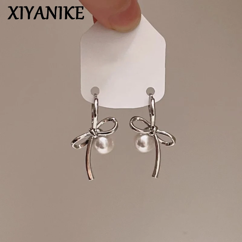 

XIYANIKE New Year Asymmetric Pearl Bow Earrings For Women Minimalist Fashion Jewelry Lady Valentine Gift Party Wedding сережки