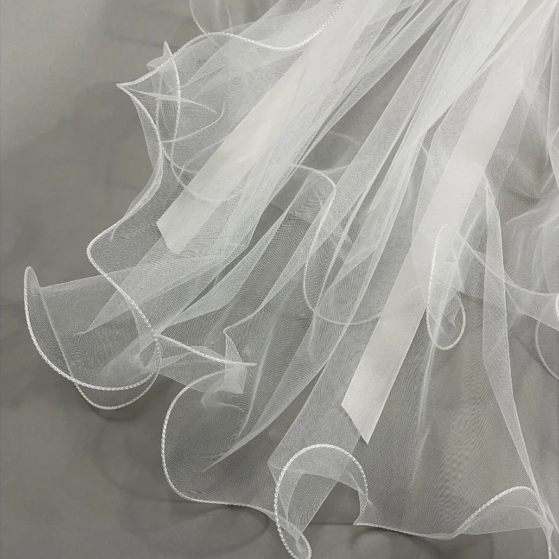 Velo da sposa per addio al nubilato, velo da matrimonio bianco con fiocco, elegante velo in tulle a strati con fermaglio per capelli per donne e ragazze - immagine 4