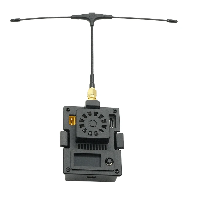 Module ELRS Micro TX 2.4G/915MHz posé sur une surface, montrant sa taille compacte et ses dissipateurs thermiques