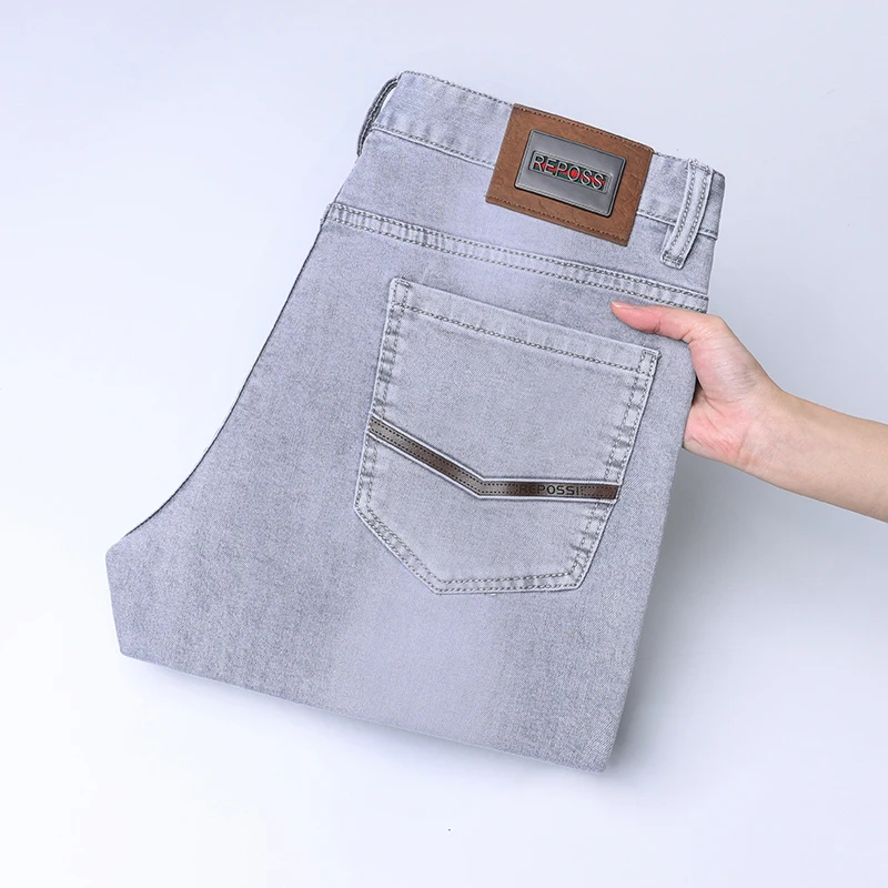 Spring new high-end trend fashion shallow gray casual men's jeans simple Slim small feet European goods stretch versatile pants