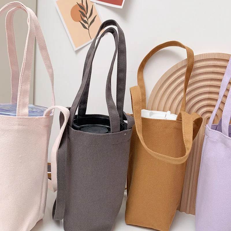 https://ae01.alicdn.com/kf/S0884a066d4b74530af1b1e9bda4f8557o/Crossbody-Water-Cup-Bag-Solid-Color-Tumbler-Protector-Coffee-Glass-Hand-Held-Portable-Thermos-Bottles-Holder.jpg
