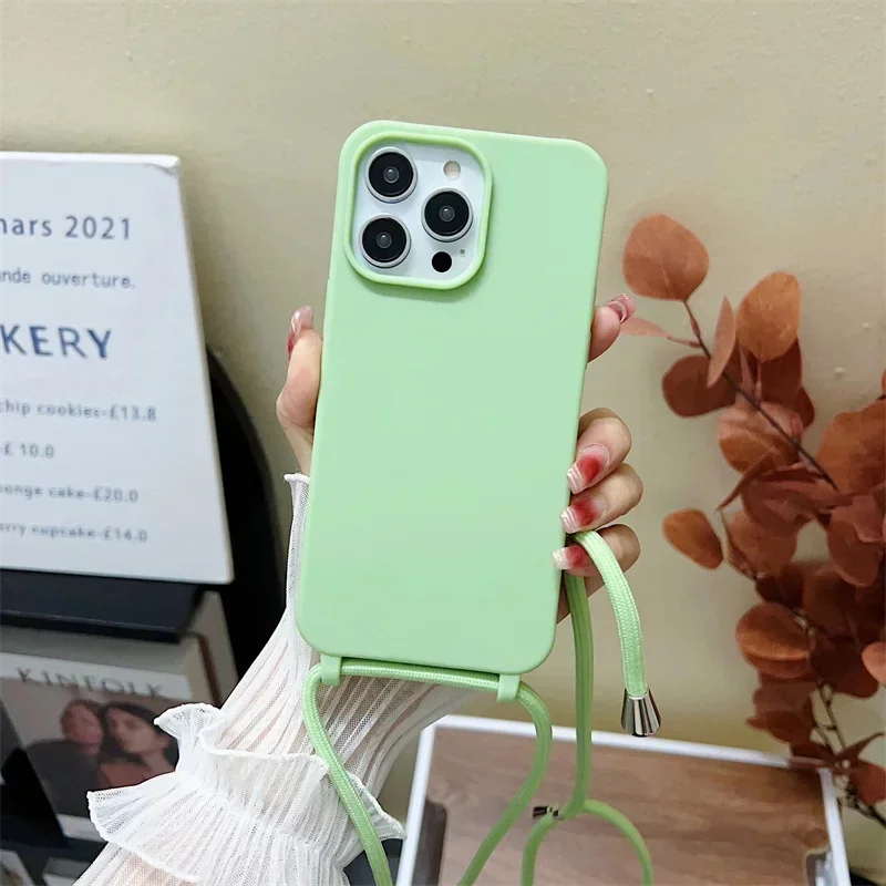 thumbnail image 1 of Funda de teléfono de silicona con correa cruzada y cordón para iPhone 16, 15, 14, 13, 12 Mini, 11 Pro Max Plus, carcasa trasera de TPU suave de color caramelo, 1 of 5