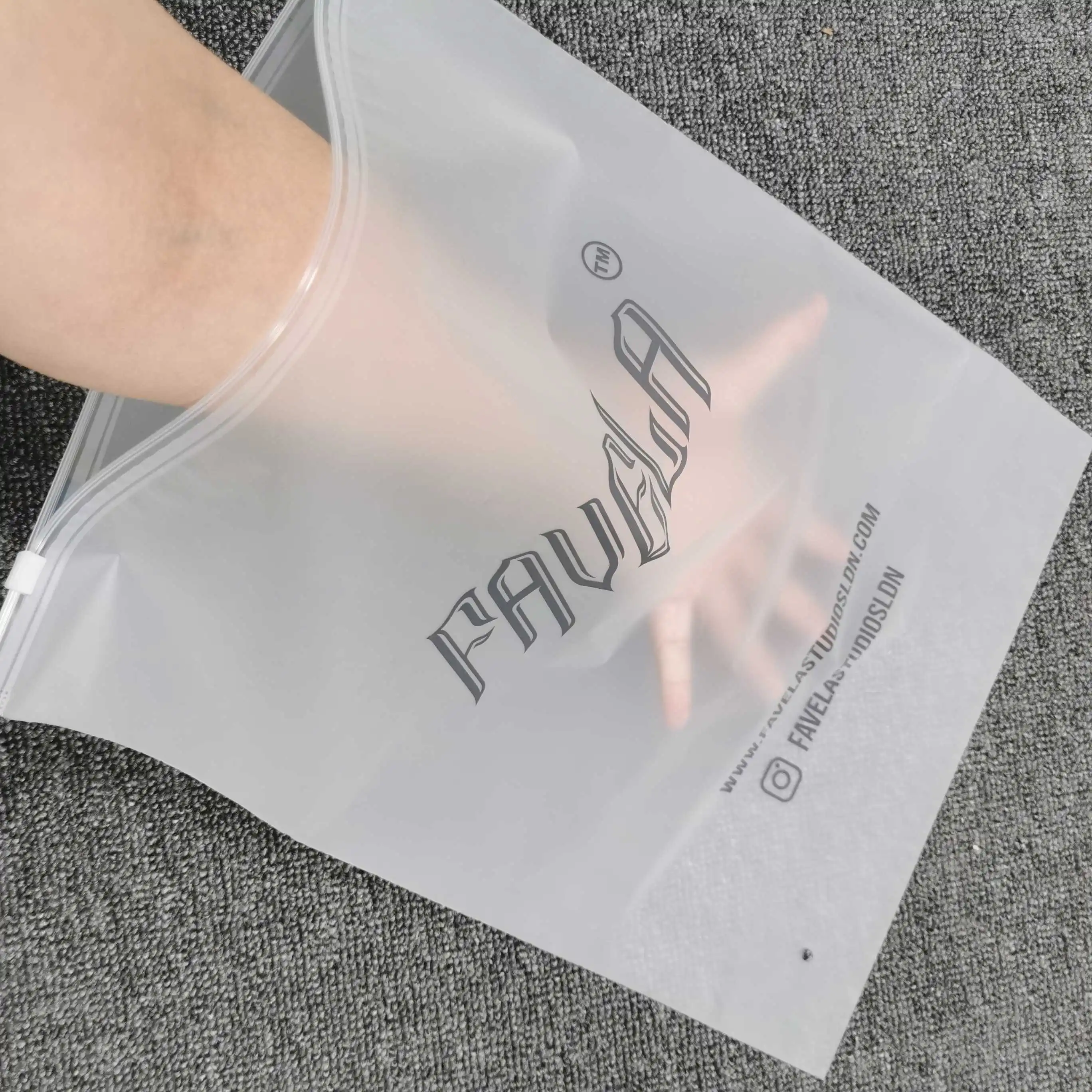 https://ae01.alicdn.com/kf/S092050ed44994a26a0bb6db4481f21dab/Translucent-PVC-Clear-Plastic-Bags-Custom-Logo-Frosted-Poly-Zipper-Bags-For-Clothes-Shoes-Packaging.jpg