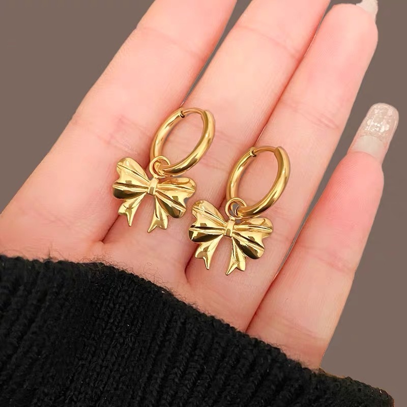 1 pair of stainless steel waterproof, non-fading, fashionable gold bow party earrings