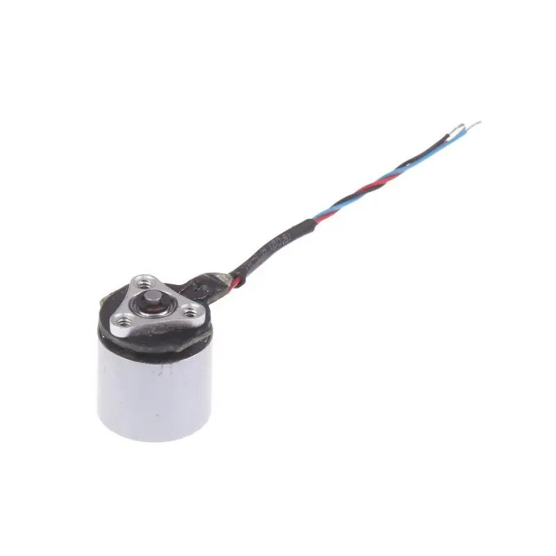 Micro moteur électrique métal 1,2x1 cm argent posé sur une surface blanche, vue de dessus.