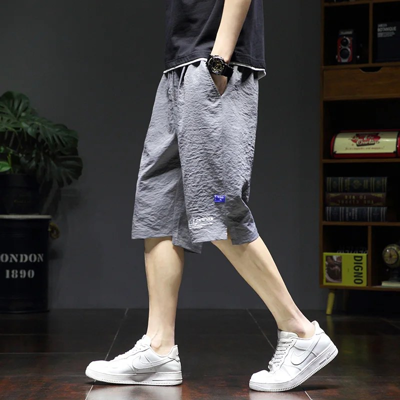 

Sports Stylish Printed Casual Shorts Summer Korean Loose Straight Men's Clothing All-match Youthful Vitality Elastic Knee Pants
