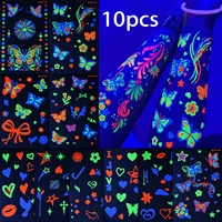 10 autocollants de tatouages temporaires néon UV, motifs variés (papillon, nœud, fleur, étoile, cœur), pour décorer le corps lors de festivals de musique et de soirées en club. 1