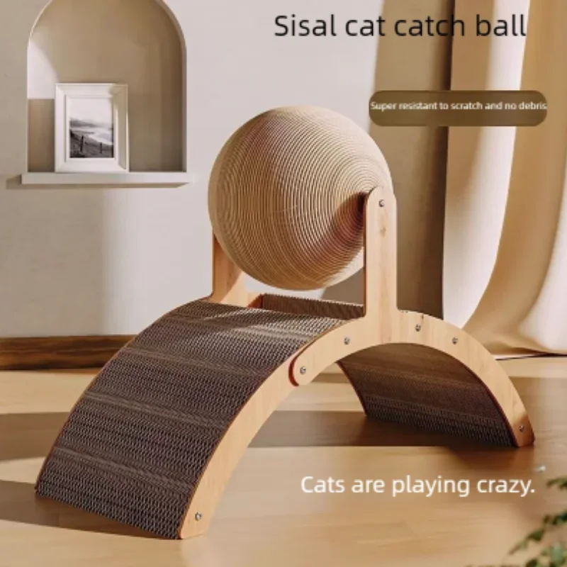 A professionally lit studio shot of the sisal cat scratcher placed on a light wood floor in a modern room. The background features a minimalist arched wall niche. The text "Sisal cat catch ball" is displayed in the upper right corner, emphasizing its debris-free design.