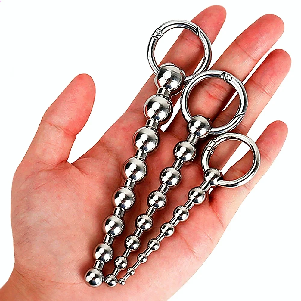 Roestvrijstalen urethrale massagekralen, functioneert als SM-inbrengkatheter in combinatie met een metalen penisplug voor mannelijk seksspeeltje._voghion.com