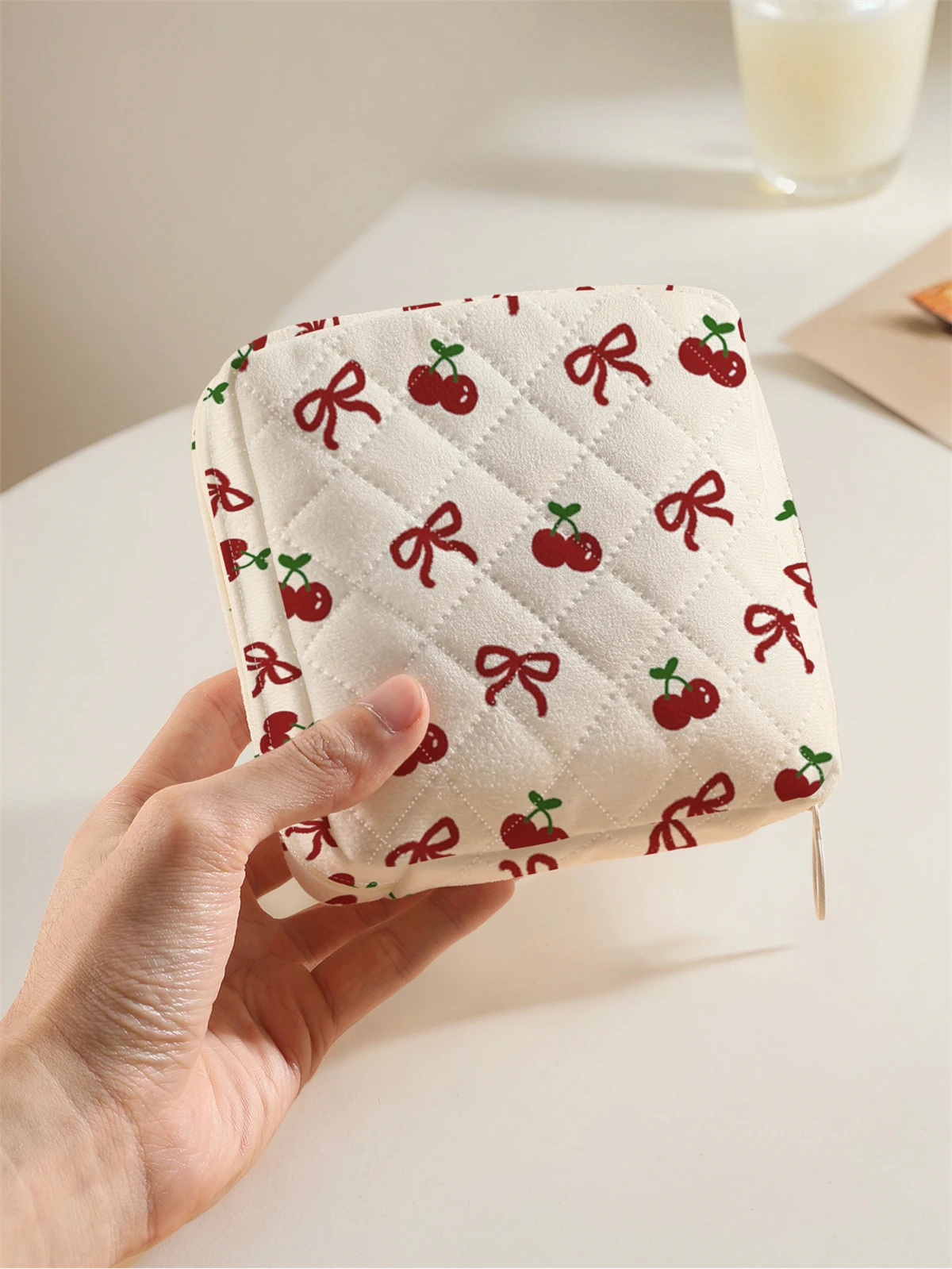 1 portable sanitary napkin storage bag with cherry bow pattern and diamond mesh material, lightweight women's tissue bag