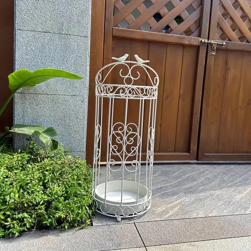 Space-Saving Umbrella Stand Conveniently stores multiple umbrellas and rain gear at home or office