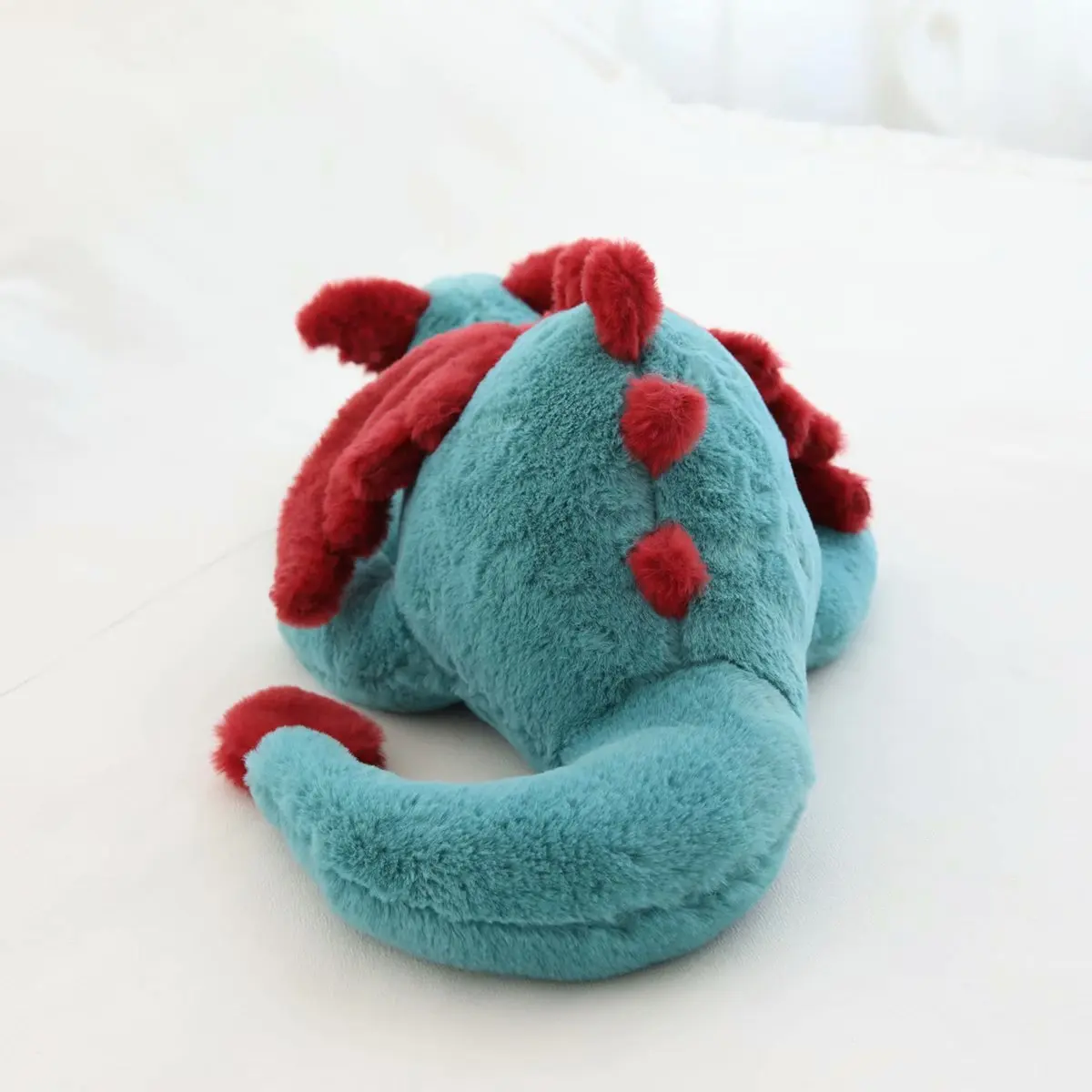 dragon en peluche roda