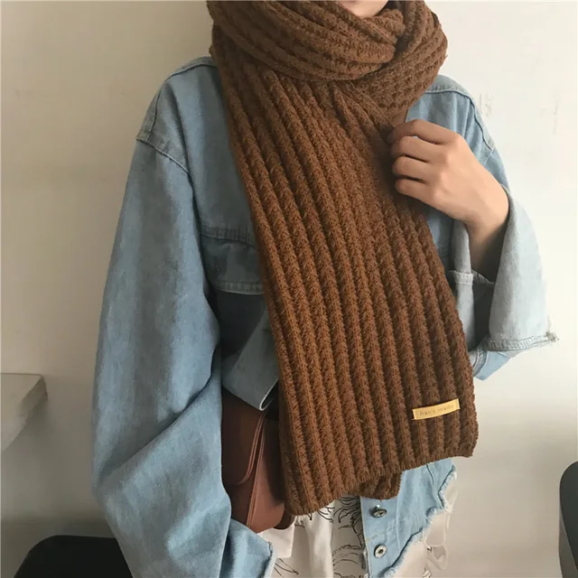 Stay warm and stylish this winter with the Womens Winter Millet Grain Solid Color Wool Warm Student Knitted Scarf