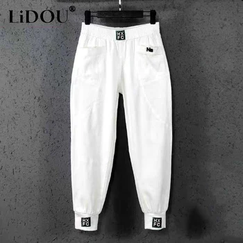 Autunno inverno Harajuku Y2K tinta unita elastico in vita pantaloni da Cowboy donna moda tasca Haren pantaloni Casual abbigliamento femminile 1