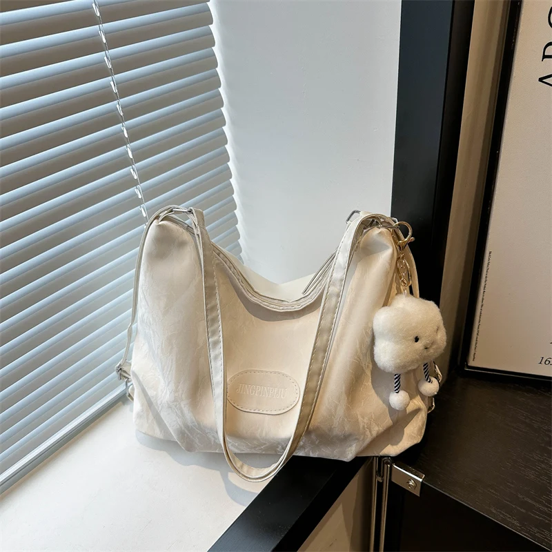 White cloud ornament with colorful rope